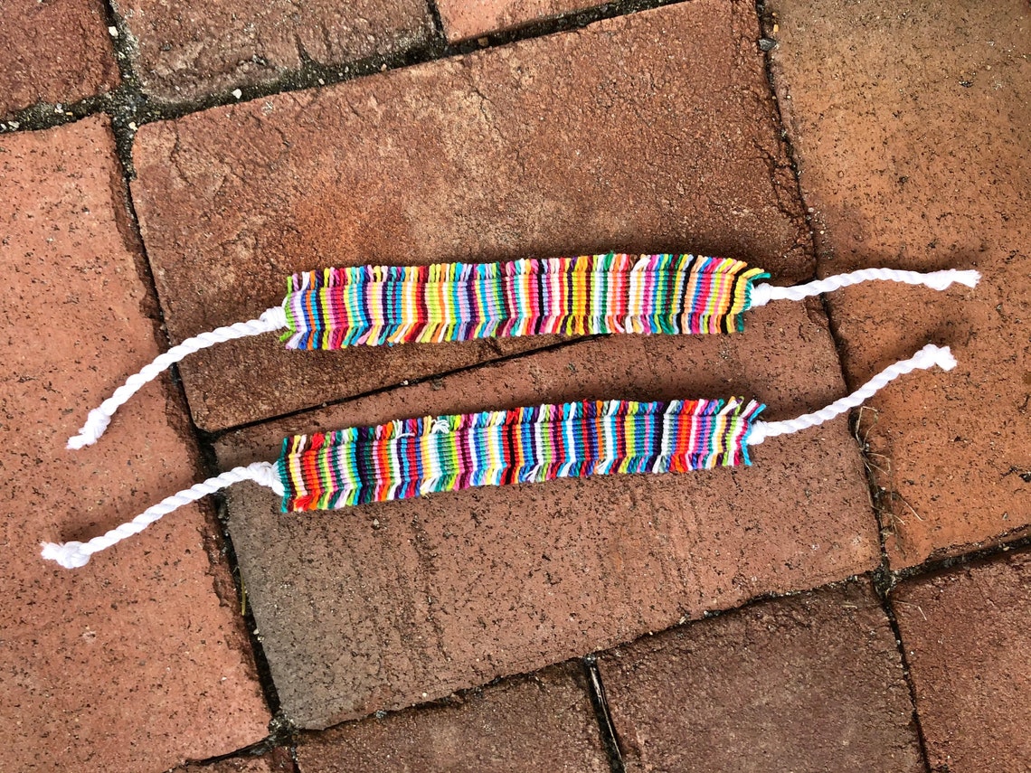 Handmade recycled colorful rag rug friendship bracelets. See Etsy