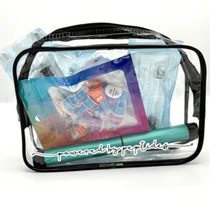 May include: A clear rectangular zipped pouch containing medical supplies, including a teal pen-like device with the text "powered by peptides" printed on the front, various small plastic needle tips in a bag, and sealed medical packaging.