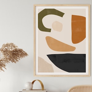 May include: A framed abstract art print with geometric shapes in shades of green, orange, brown, and black on a cream background.