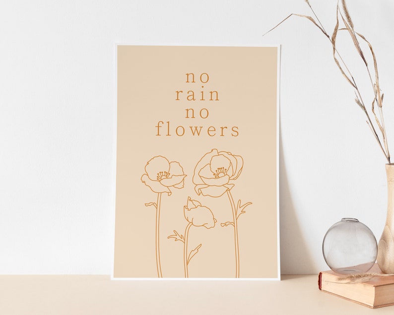 May include: A beige printable art print with the text "no rain no flowers" in brown text. The print features a line drawing of three poppy flowers in brown.