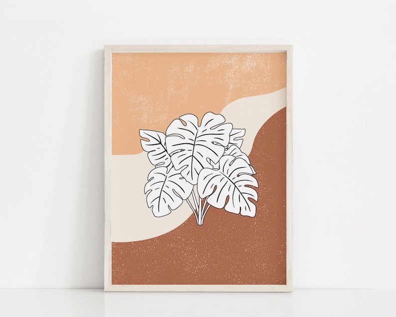 May include: A printable art print featuring a white line drawing of tropical leaves on a background of orange, brown, and cream.