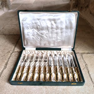 Gorgeous, vintage, damascene style, steel and brass fruit / cocktail knives and forks made in Toledo, Spain. Circa 1950&#39;s / 60&#39;s