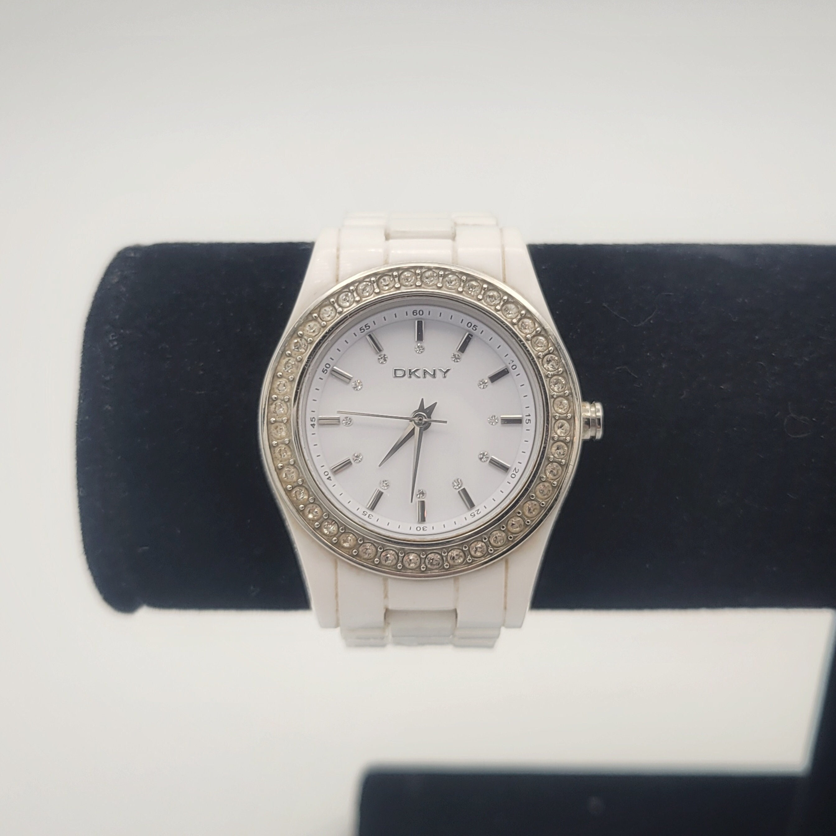 DKNY WATCH. White and Chrome. Has 3 circles from other  time zones. Used. Amazon.com: DKNY Women main image 3