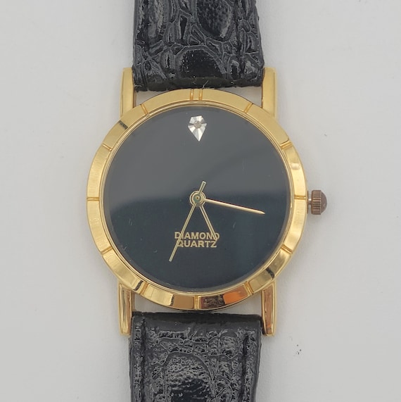 Orologio oro e nero sale