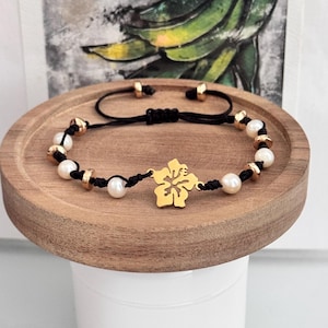 Adjustable black thread bracelet with Puerto Rico flower. Hibiscus flower, Maga flower. DTmF.
