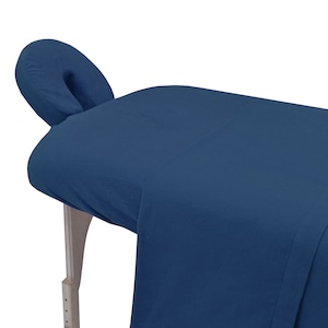 May include: A dark blue massage table with a matching headrest. The table is made of a soft, comfortable material and is perfect for relaxation and rejuvenation.