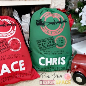 May include: Two red and green Christmas gift bags with white text. The bags are decorated with a Santa Claus and reindeer design. The text on the bags reads "Express Delivery from the North Pole" and "Do Not Open Before 25 December". The bags are personalized with the names "Jace" and "Chris".