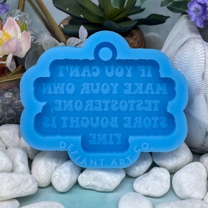 May include: Blue silicone mold for making a resin keychain with the text "If you can't make your own,  store bought is fine.  Test  toaster, one"