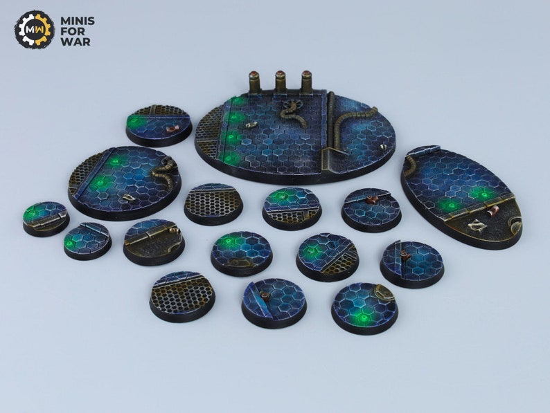 May include: A set of 15 round and oval-shaped gaming bases with a futuristic, cyberpunk theme. The bases are painted in shades of blue, black, and green with a honeycomb pattern and various details like pipes and wires.