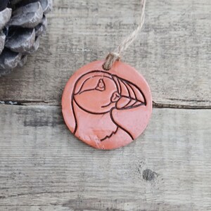 Difusor de aromaterapia redondo de terracota con relieve rústico Puffin