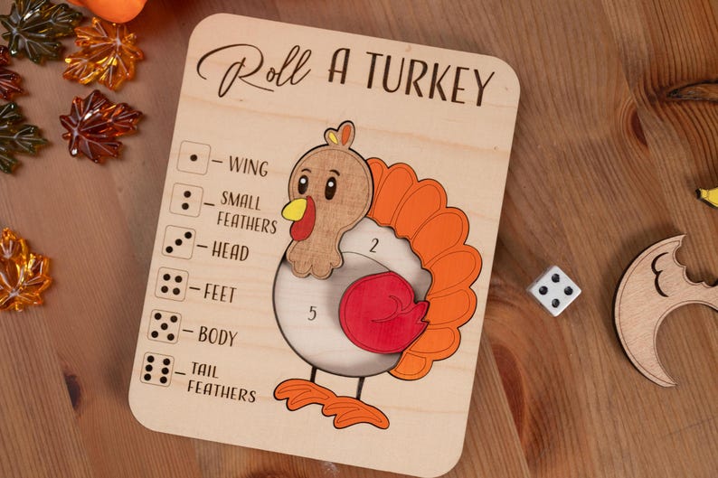 May include: Wooden "Roll a Turkey" game board with a cartoon turkey illustration. The board features a dice game with numbered sections for different turkey parts. The text "Roll a Turkey" is at the top.
