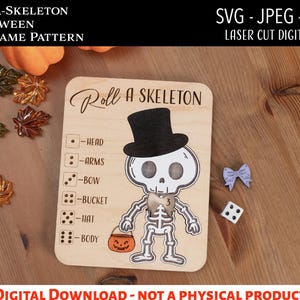 May include: A wooden Halloween dice game pattern with the text "Roll-A-Skeleton". The game features a skeleton illustration wearing a top hat and holding a pumpkin bucket. Includes dice and a decorative bow. Digital file.