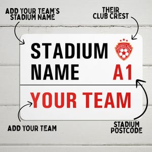May include: White metal sign with black text that reads "Stadium Name" and "Your Team". The sign also features a red and white soccer team crest with the text "Football Team" and the number "A1".