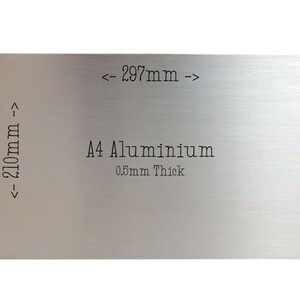 May include: A silver A4 aluminum sheet measuring 297 mm by 210 mm and 0.5 mm thick.