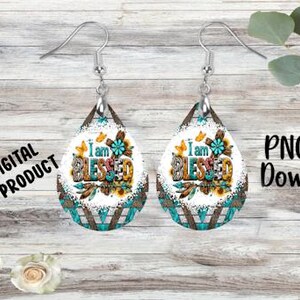 May include: Teardrop-shaped earrings with a floral and butterfly design, featuring the text "I am BLESSED." The earrings have a turquoise and brown geometric pattern at the bottom. The words "DIGITAL PRODUCT" and "PNG file Download" are also visible.