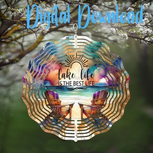 May include: A decorative metal wind spinner with a beach scene. The design features two wooden chairs on a sandy beach, the text "lake life is the best life", and a colorful watercolor background. The spinner is hanging outdoors.