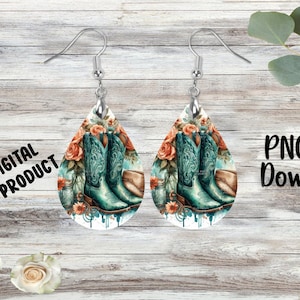 May include: A pair of teardrop-shaped earrings with a white background and a design of teal cowboy boots, orange roses, and a mason jar.  The earrings are on a wooden background.