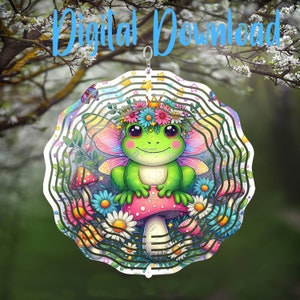 May include: A colorful metal wind spinner featuring a cartoon frog wearing a flower crown and fairy wings, sitting on a mushroom with a pink top. The spinner has multiple layers of swirling designs and stars.