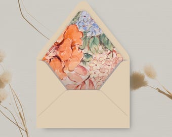 May include: A cream-colored envelope with a floral pattern on the inside flap. The pattern features orange, pink, blue, and green flowers.