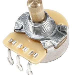 May include: A close-up of a silver and cream-colored potentiometer with a brass knob. The potentiometer has three terminals on the bottom.