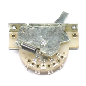 May include: A silver-toned guitar switch with a lever and a rotary dial. The switch has a spring mechanism and is designed for use with electric guitars.