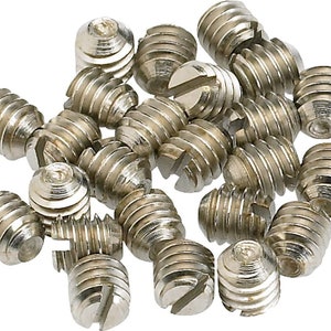 May include: A pile of silver-toned screws with a slotted head. The screws are small and have a fine thread.