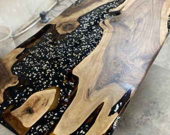 Black epoxy filler in a pin oak table top. The contrast is…