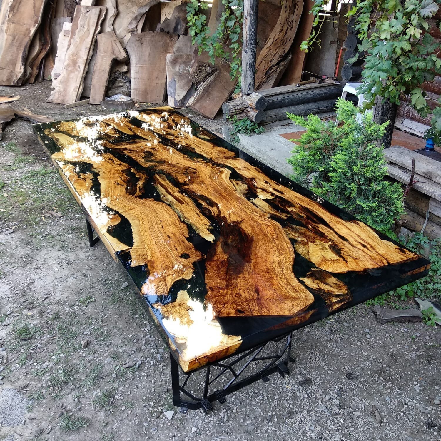 Black Epoxy River Table With Custom Metal Base – Collective Arts Media