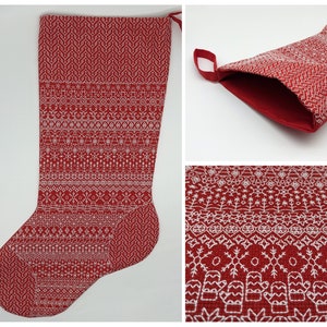 May include: Red Christmas stocking with a white embroidered design of snowflakes, trees, and other winter motifs.