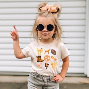 Voluntarios de Tennessee Fútbol americano PNG de Rocky Top Fútbol americano de Tennessee Sublimación de Tennessee Vols Retro Daisy Tennessee Girl Lazo de moda