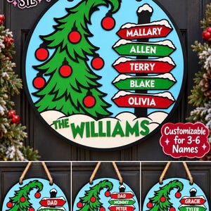 May include: A round wooden Christmas door sign featuring a light blue background, a green drooping tree with red ornaments, and a stack of red and green directional signs with white text. The sign includes a rope hanger and custom names.