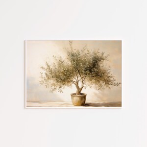 May include: A framed painting of an olive tree in a pot. The artwork features a muted color palette with shades of green, brown, and beige. The tree is centered, with detailed leaves and branches. The pot is a light brown.