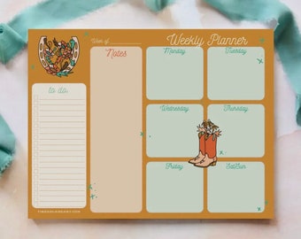 May include: A weekly planner with a brown background and a green and white grid. The planner has a to-do list, notes section, and a daily planner for Monday through Sunday. The planner is decorated with a horseshoe and flowers, and the text "Weekly Planner" is at the top.