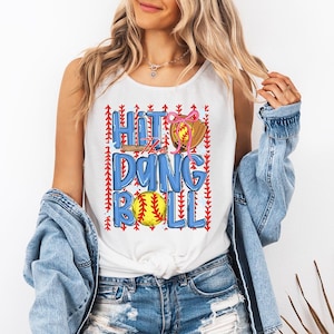 May include: White vest top with the text "Hit the Ding Roll" in blue, featuring a baseball, glove, and bat graphic. The baseball is yellow with red stitching, and the glove is brown. The design is accented with red arrow details.