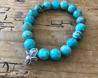Turquoise beaded bracelet with silver elephant charm