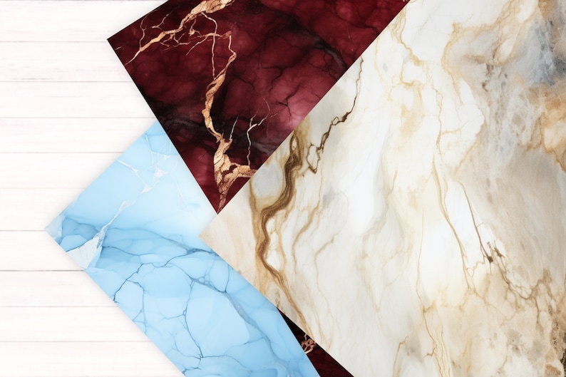 May include: Three abstract marble-like patterns in a triangular arrangement. The top pattern is a deep red with gold veins, the left pattern is a light blue with white veins, and the right pattern is a light beige with brown veins.