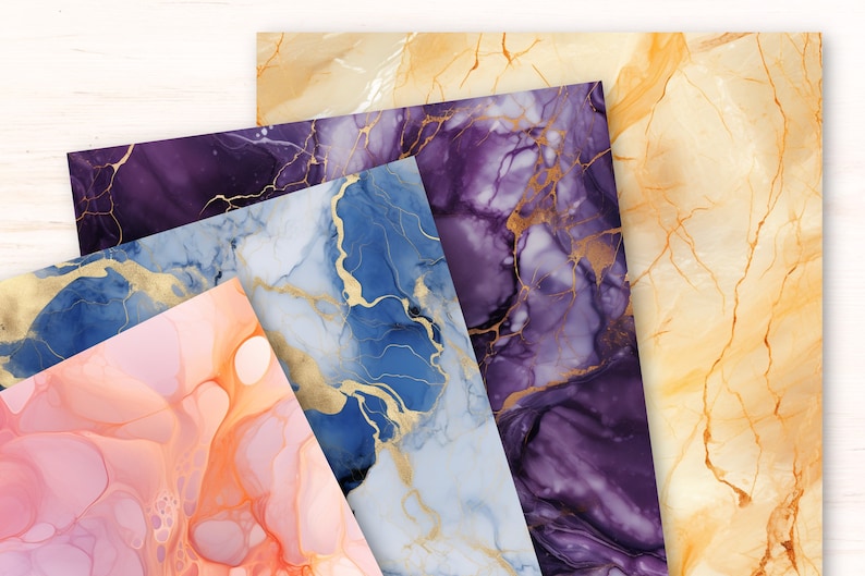 May include: Four sheets of paper with abstract marble patterns in shades of blue, purple, pink, and yellow with gold accents.