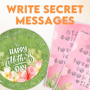Op de afbeelding: Een groene en roze waterverf cirkel met de tekst "Happy Mother's Day" in wit. De cirkel is omgeven door een rand van witte bloemen, bladeren en andere ontwerpen. Twee roze kaarten met zwarte contouren van verschillende ontwerpen zijn zichtbaar op de achtergrond. De tekst "Write Secret Messages" is in oranje bovenaan de afbeelding geschreven.