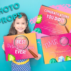 Kids escape room photo prop. A cute girl smiling, holding a certificate. It says "Best Detective Team Ever!".