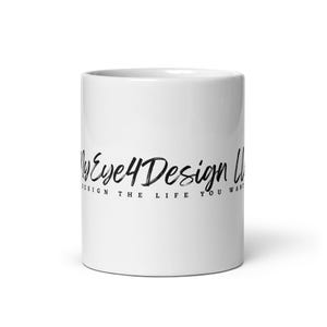 May include: A white ceramic mug featuring the black text MyEye4Design LLC in a stylized script font, with the additional black text DESIGN THE LIFE YOU WANT printed in a smaller, clean sans-serif font directly underneath the main logo.