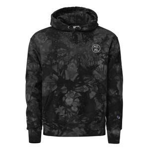May include: A black and dark gray tie-dye hooded sweatshirt featuring a front kangaroo pocket and a circular white logo on the upper left chest with the text ME 4Do. The long-sleeve garment includes a small embroidered logo on the left cuff.