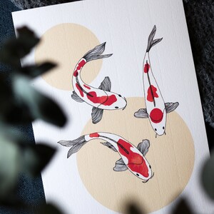 May include: Three white and red koi fish with black outlines are swimming in a circle on a white background with three beige circles.