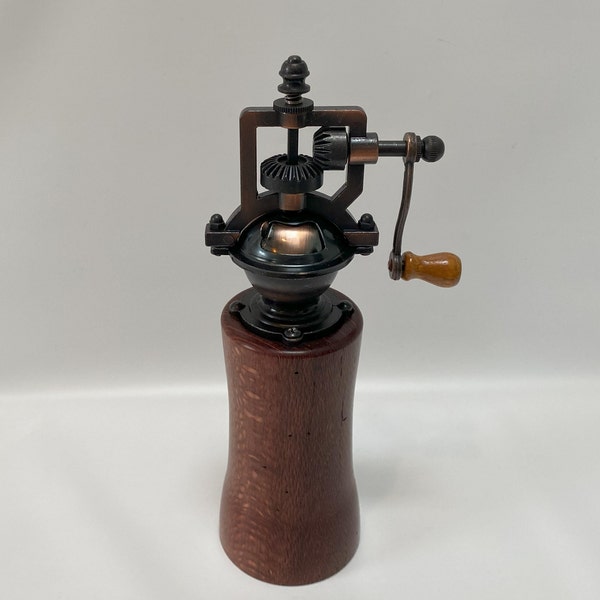 Handmade nine inch tall Macadamia wood pepper grinder