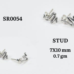 May include: Silver snake stud earrings. The earrings are in the shape of a snake. The image also includes the text "STUD", "7x10 mm", "0.7 gm", and "SR0054".