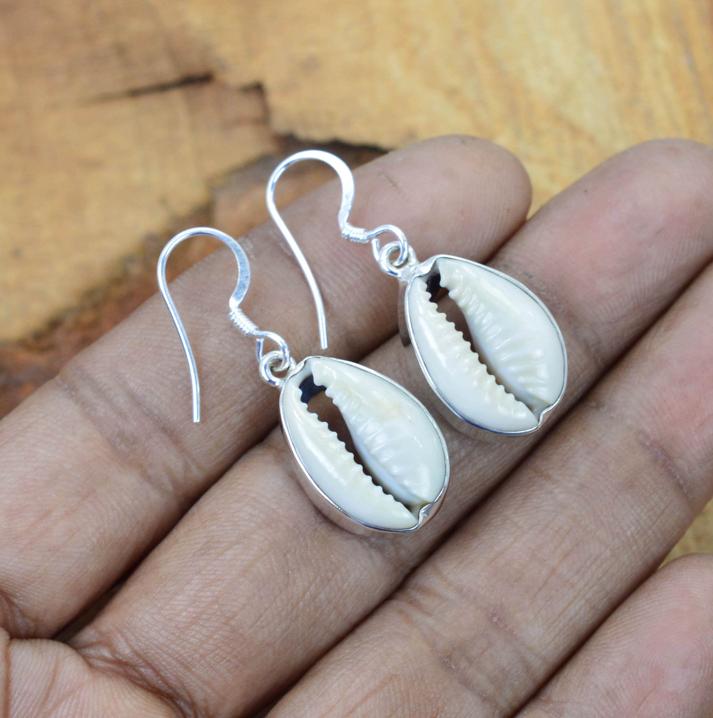 Silver cowrie shell earrings deals
