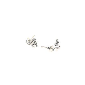 May include: A pair of silver-colored stud earrings. Each earring is shaped like a small snake with detailed scales and a curved body. The earrings are set against a white background.