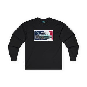 May include: Black long-sleeve t-shirt with a vintage-style graphic of a green Chevrolet pickup truck with the text "Chevy" and "57" on a white, red, and blue background.