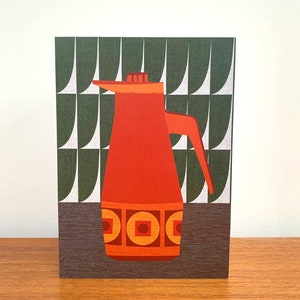 May include: A red and orange ceramic jug with a geometric pattern on a green and brown background.