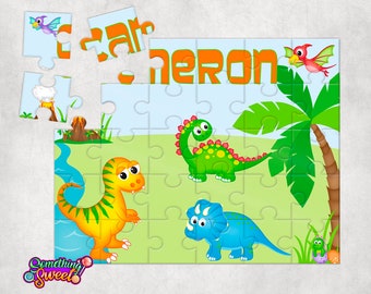 May include: A colorful dinosaur-themed puzzle with a green, yellow, and blue dinosaur, a pink flying dinosaur, and a palm tree. The puzzle is personalized with the name "Cameron".