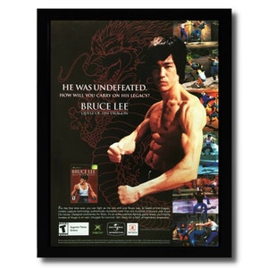 May include: A vintage video game advertisement for Bruce Lee: Quest of the Dragon. The ad features a photo of Bruce Lee in a fighting pose, with the game's title and logo in the background. The ad also includes a description of the game's features, such as motion capture technology and over 100 of Bruce Lee's Jeet Kune Do moves.
